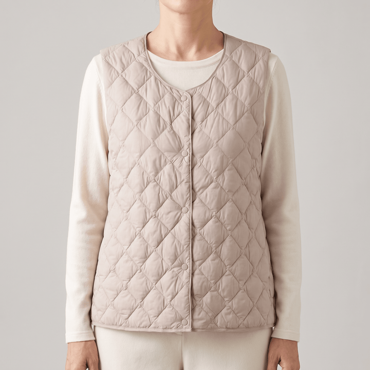 Beige quilted sleeveless vest with diamond stitching and button-front closure