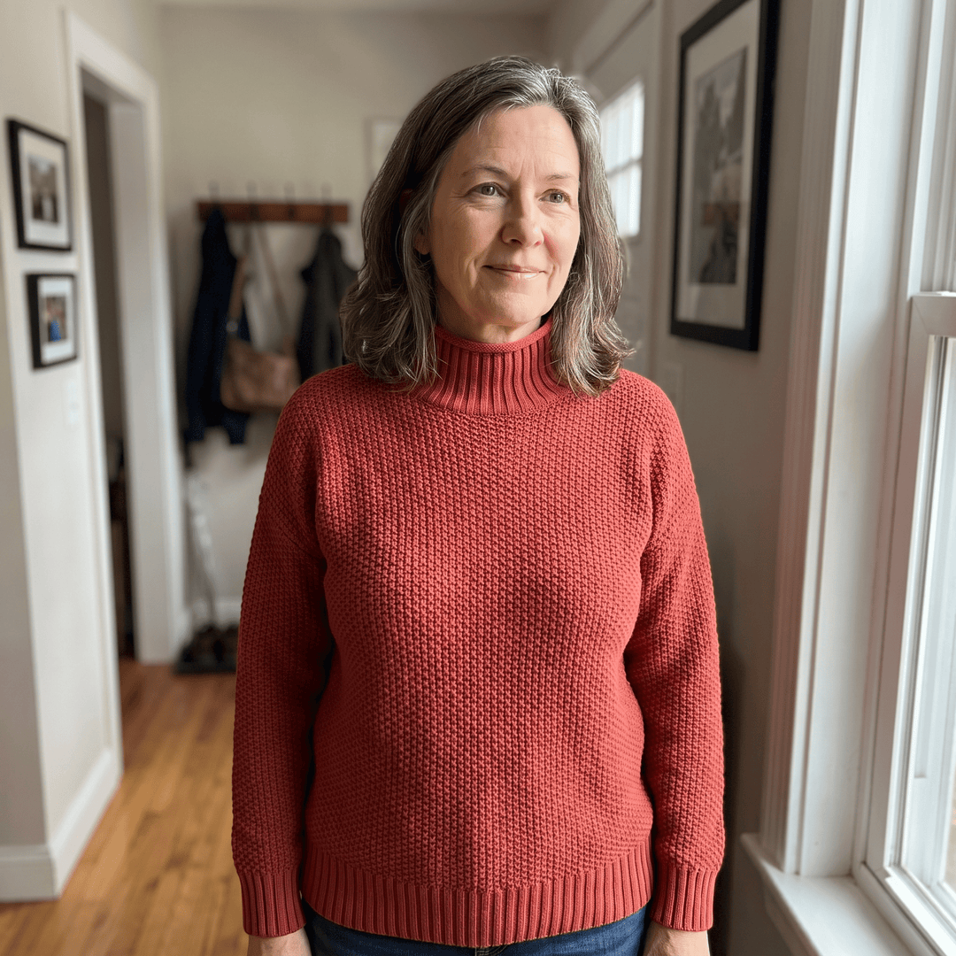 Red cashmere mock-neck sweater with ribbed cuffs and hem on model