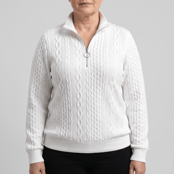 White cable-knit sweater with half-zip front and ribbed cuffs and hem
