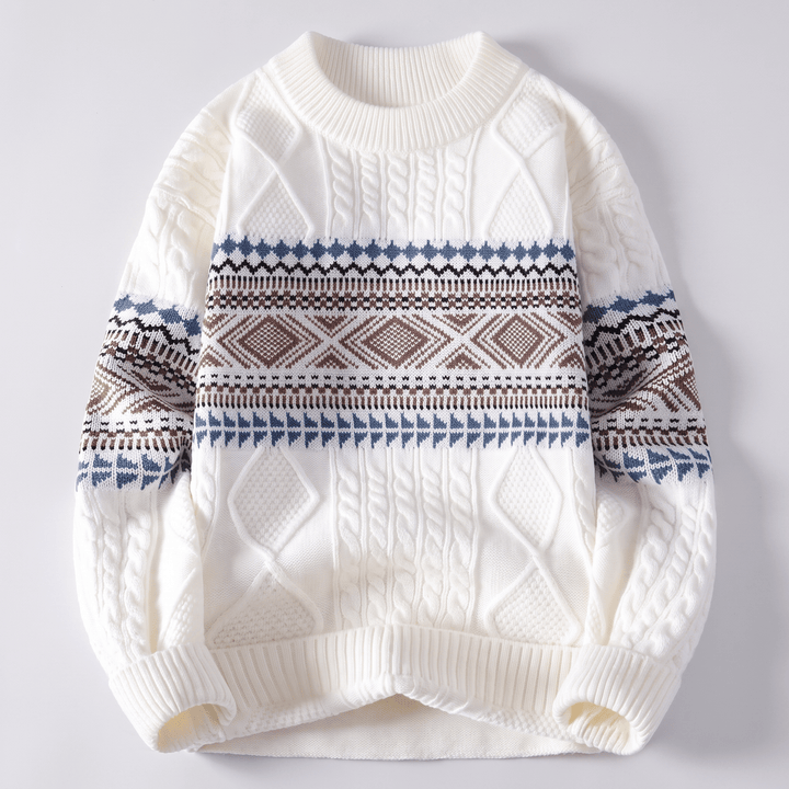 White crew-neck cable knit sweater with navy and brown Nordic fair isle stripe pattern