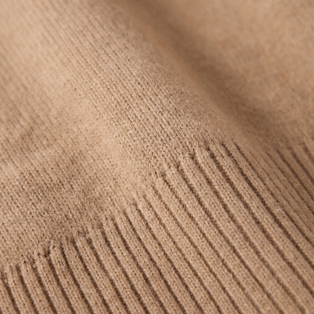Close-up of camel cashmere turtleneck knit texture with visible ribbing