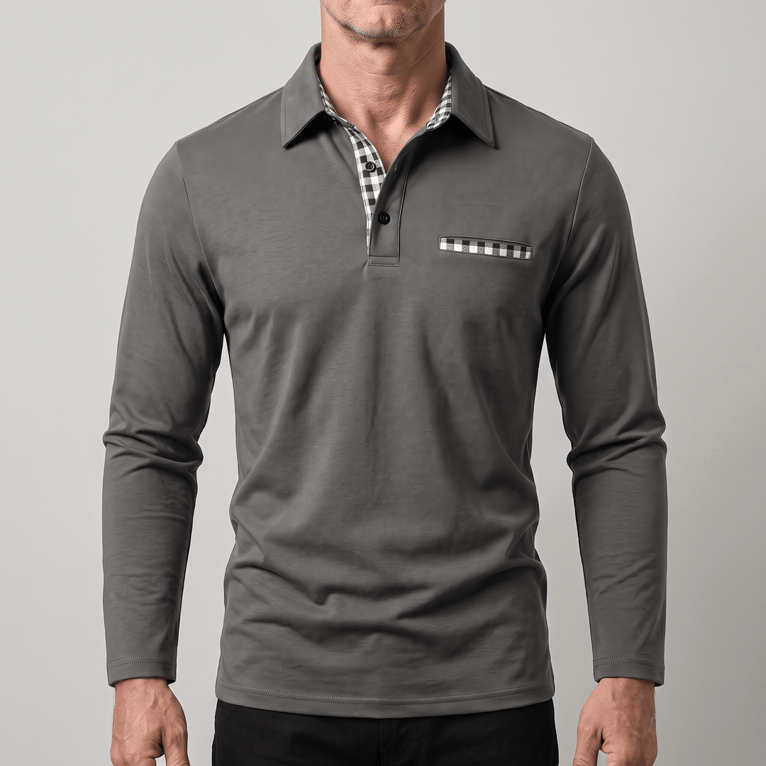 Calverton long-sleeve polo in dark grey, checked collar lining, chest pocket accent