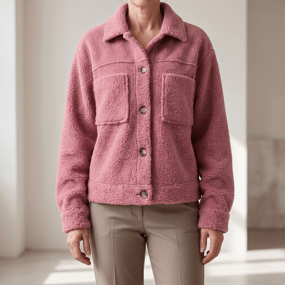 Soft winter coat in pink fleece texture, button front, point collar, two chest pockets