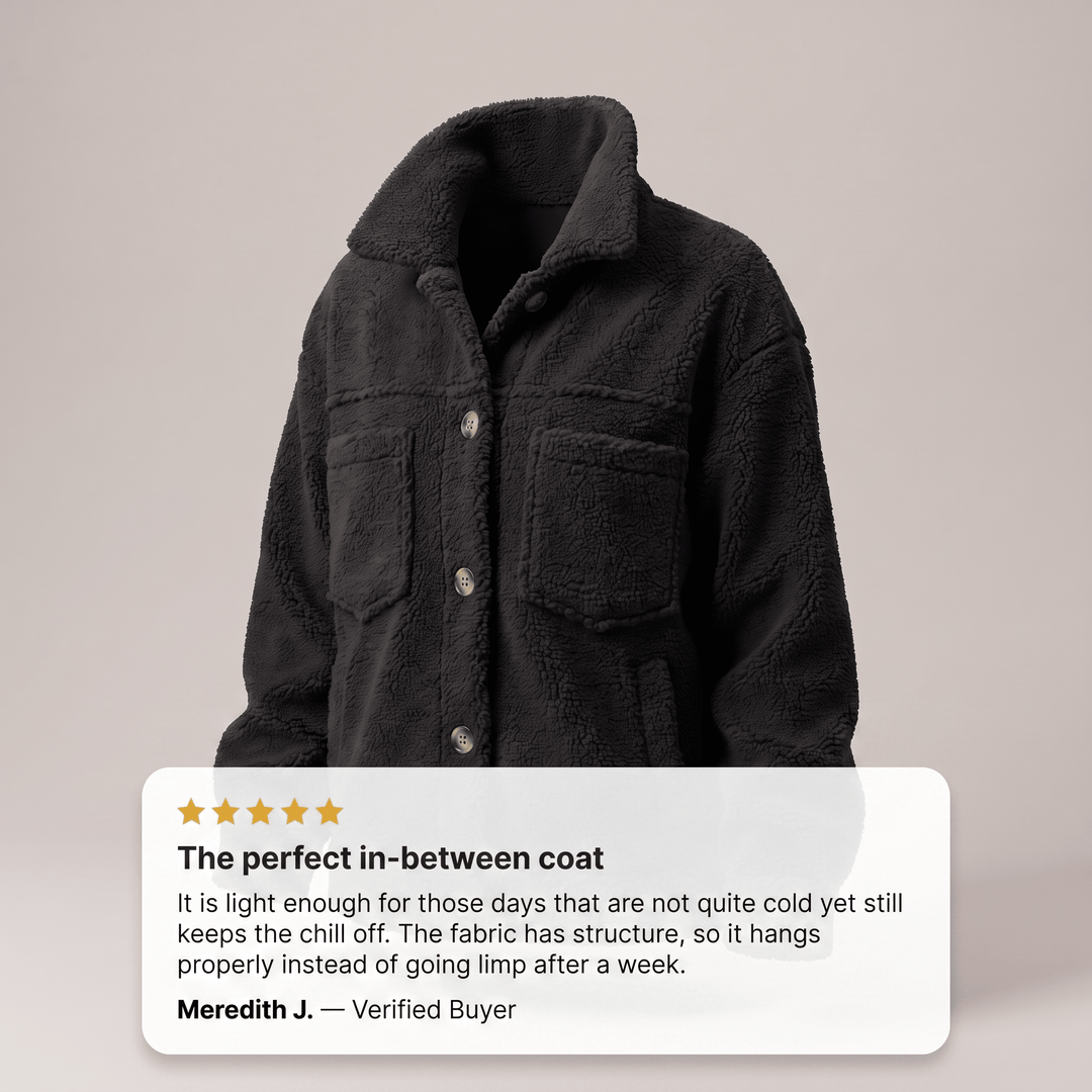 Black fleece winter coat with hood, button front, two chest pockets, long sleeves