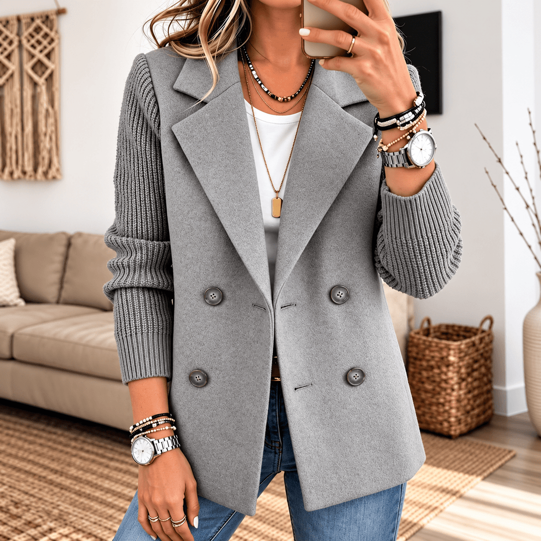 Grey knit-sleeve double-breasted blazer with four button details and notched lapels