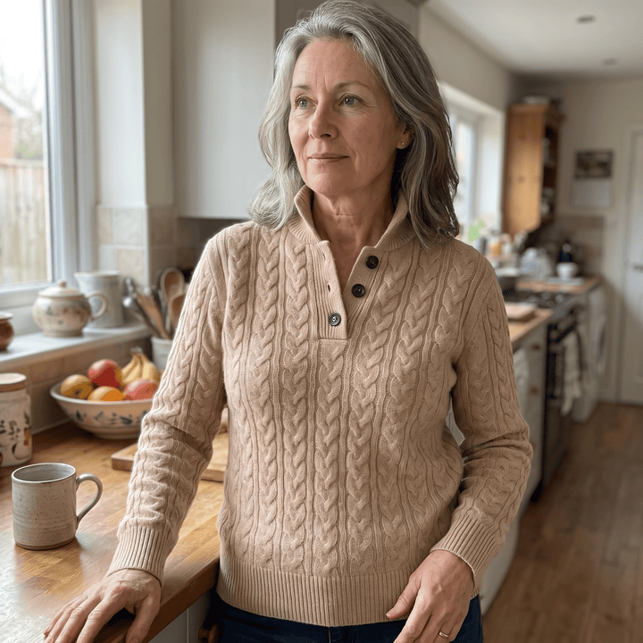 Celeste cashmere sweater in beige on model, cable knit texture, buttoned mock placket