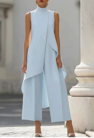Light blue sleeveless high-neck maxi dress with asymmetrical drape overlay