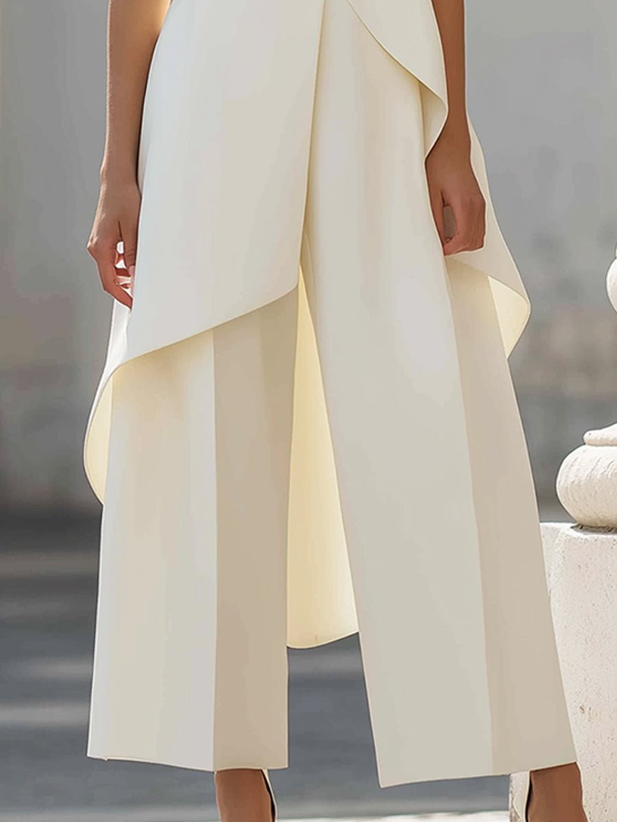 White sleeveless maxi dress with layered asymmetrical hem and draped sides