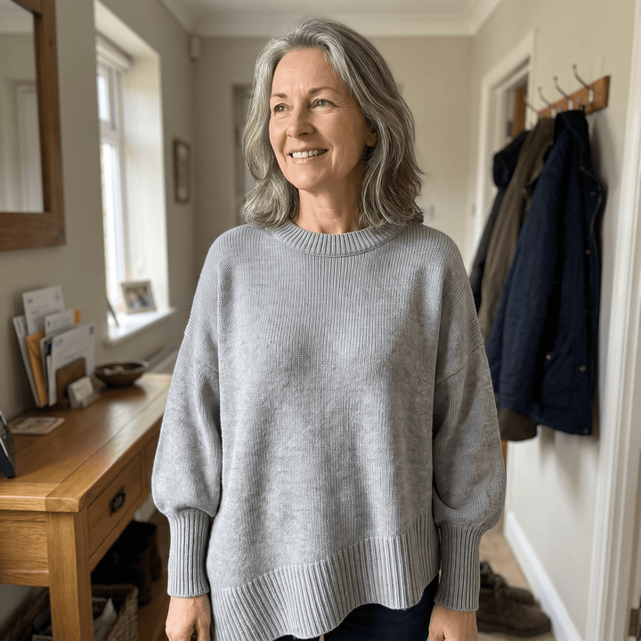 Light grey ribbed crewneck pullover sweater with dropped shoulders and long cuffs