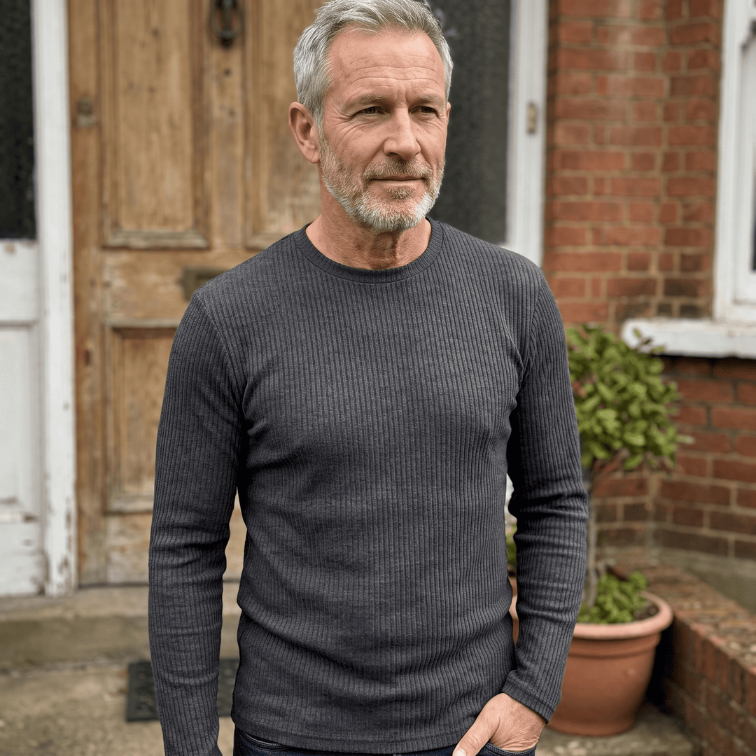 Ribbed crewneck sweater in dark grey, long sleeves with vertical knit texture.