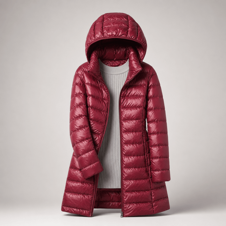 Ultralight down jacket in deep red with hood and full-zip, long coat length.