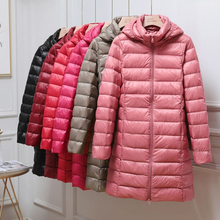 Women’s ultralight down jacket in pink, full-zip with hood, baffle stitch quilting.