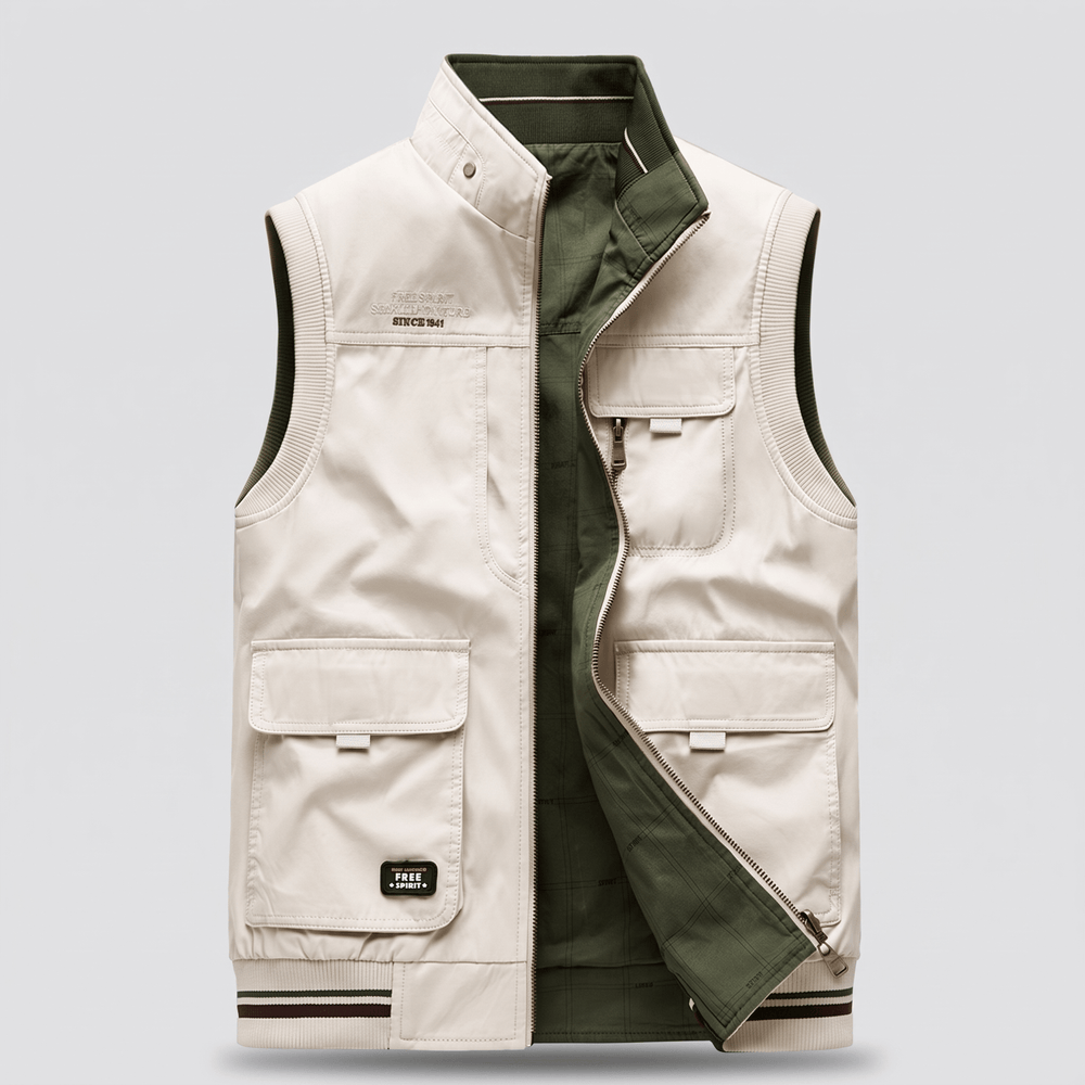 Men's reversible utility vest, cream outer with green lining, zip front and cargo pockets.