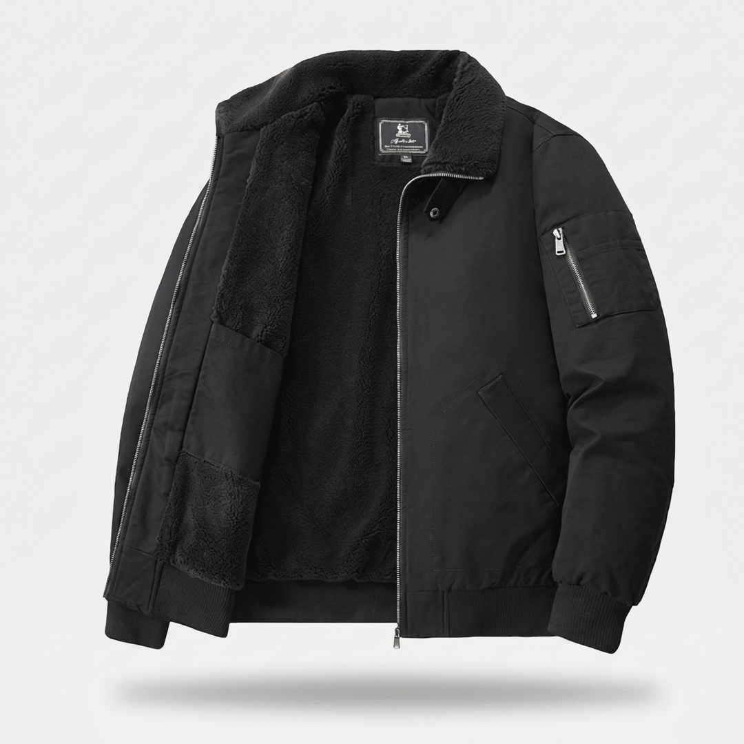 Black bomber jacket with sherpa lining, front zipper, and sleeve pocket.