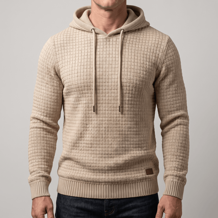 Beige waffle-knit hoodie with adjustable drawstring hood, kangaroo pocket, ribbed hem and cuffs