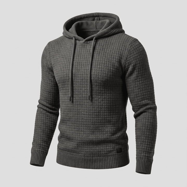 Dark grey waffle-knit hoodie with adjustable drawstring hood, kangaroo pocket, ribbed cuffs and hem