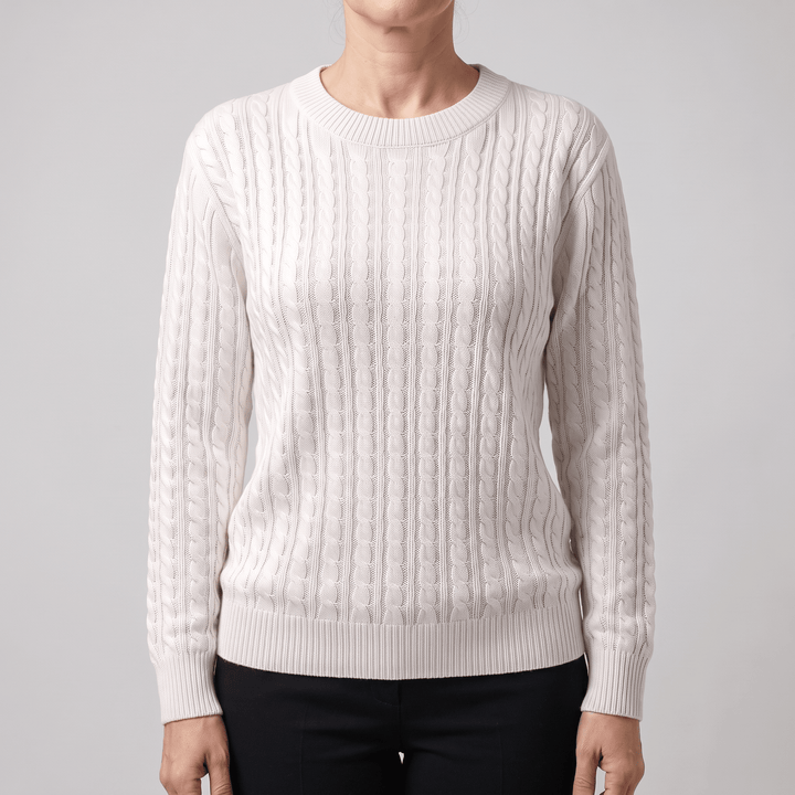White cable knit crewneck sweater with long sleeves and ribbed hem and cuffs