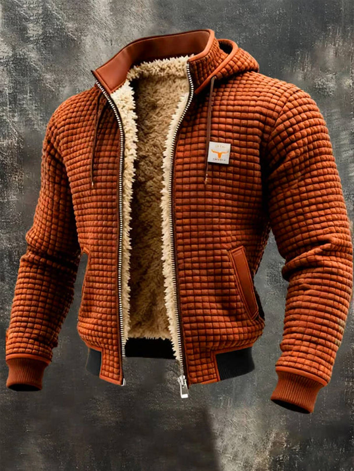 Orange quilted hooded jacket with sherpa lining, zip front, and brown leather-look trim