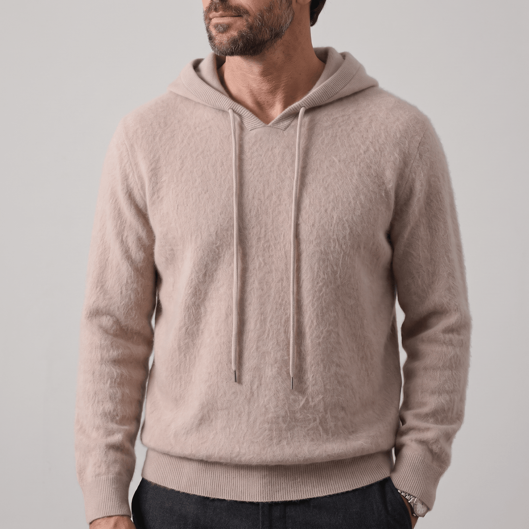 Beige cashmere hoodie with adjustable hood and drawstring, ribbed cuffs and hem.