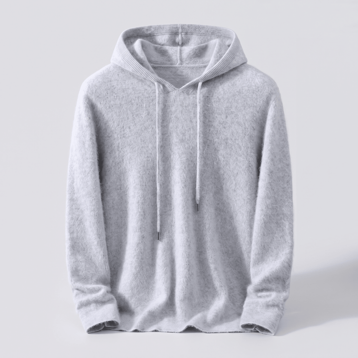 Light grey cashmere hoodie with adjustable hood drawstrings and ribbed cuffs and hem.