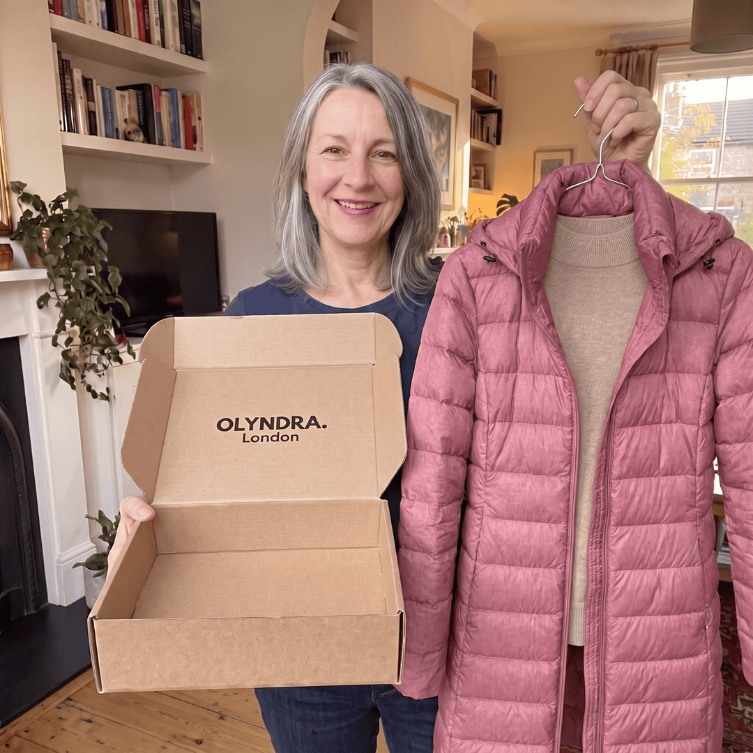 OLYNDRA mystery box with open box and pink quilted jacket