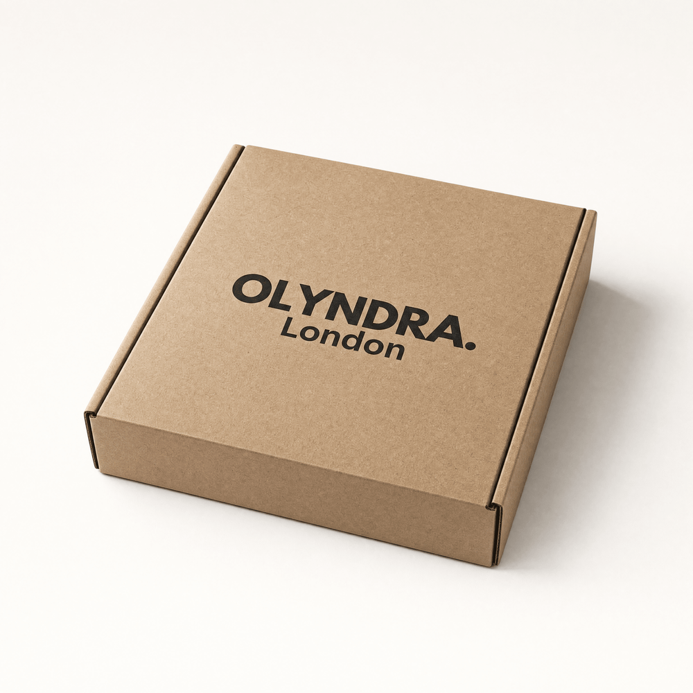 OLYNDRA mystery box in brown cardboard packaging