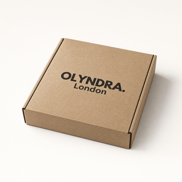 OLYNDRA mystery box in brown cardboard packaging