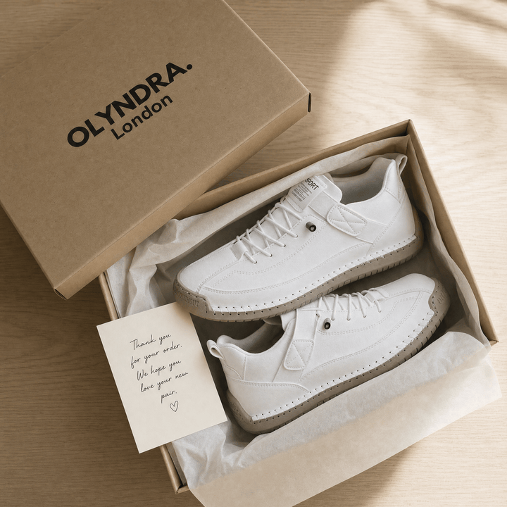 OLYNDRA London mystery box with white sneakers and note card