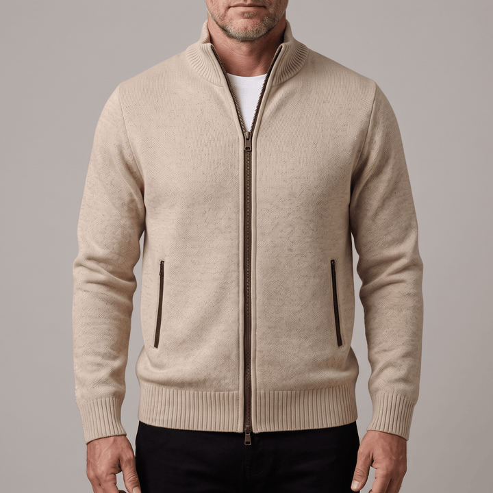 Beige zip-up cardigan with metal zipper, stand collar, and two side pockets.
