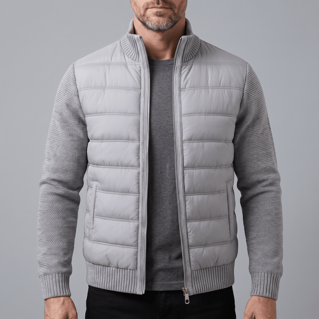 Light grey quilted jacket with knit sleeves, ribbed collar and cuffs, full zip front
