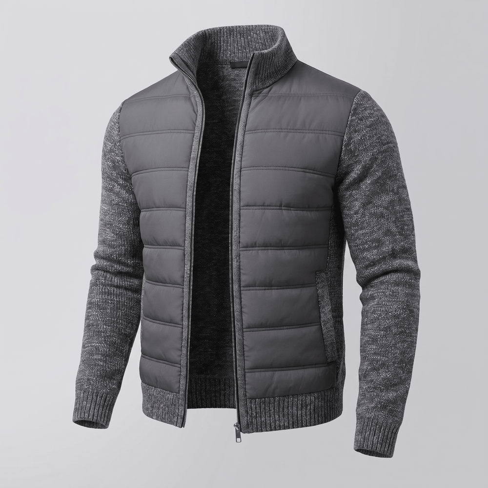 Dark grey quilted jacket with textured knit sleeves, full zip front, ribbed cuffs