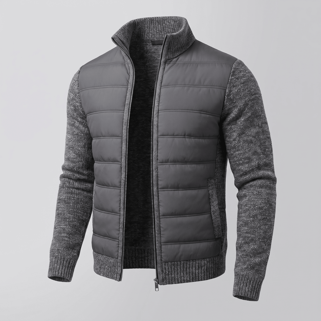 Dark grey quilted jacket with textured knit sleeves, full zip front, ribbed cuffs