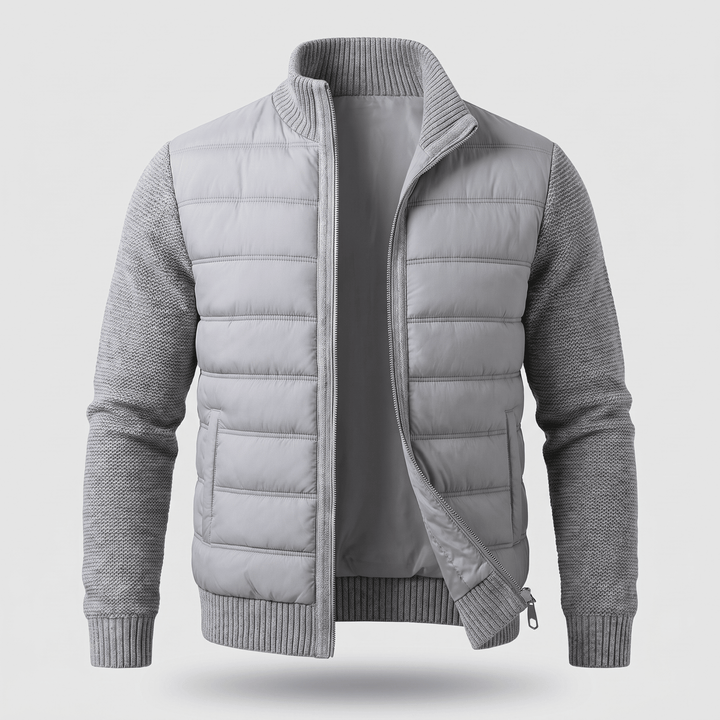 Light grey quilted jacket with knit sleeves, ribbed collar and cuffs, zip front