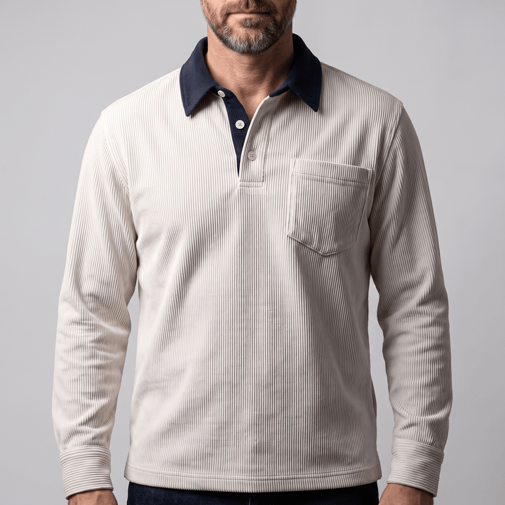 Corduroy polo shirt with long sleeves, navy contrast collar, and chest pocket