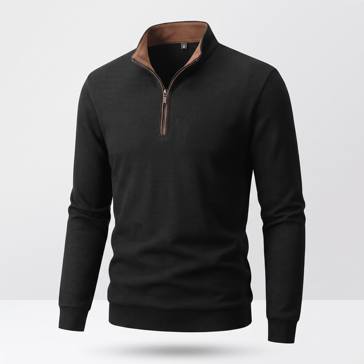TAVREN quarter-zip pullover in black with brown-trim collar and ribbed cuffs
