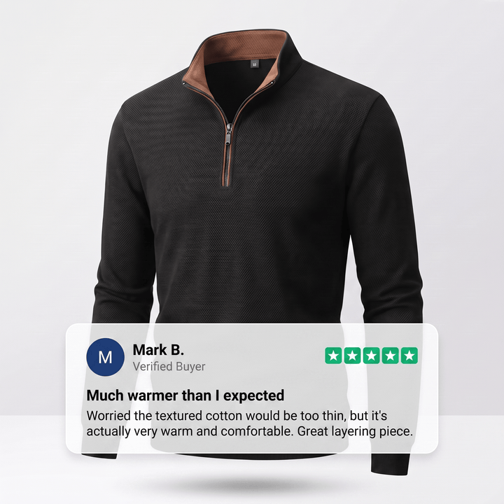TAVREN quarter-zip pullover in black with ribbed cuffs and quarter zip collar