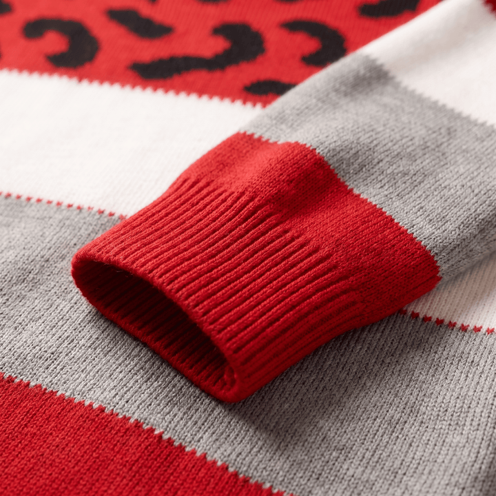 Ribbed cuff detail on leopard knit sweater in red and grey with striped trim