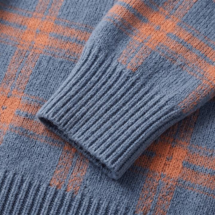 Close-up of blue-and-orange plaid cardigan knit sleeve cuff