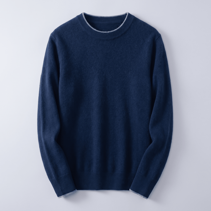 Navy blue cashmere crewneck sweater with ribbed collar, cuffs, and hem
